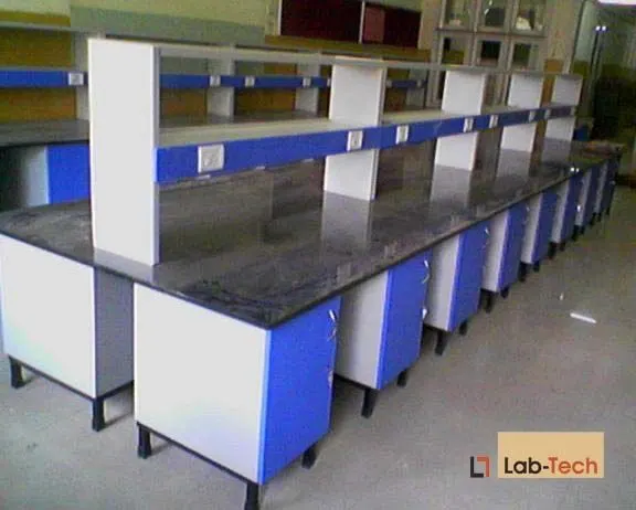 Rows of island benches with reagent racks across a full laboratory fit-out.